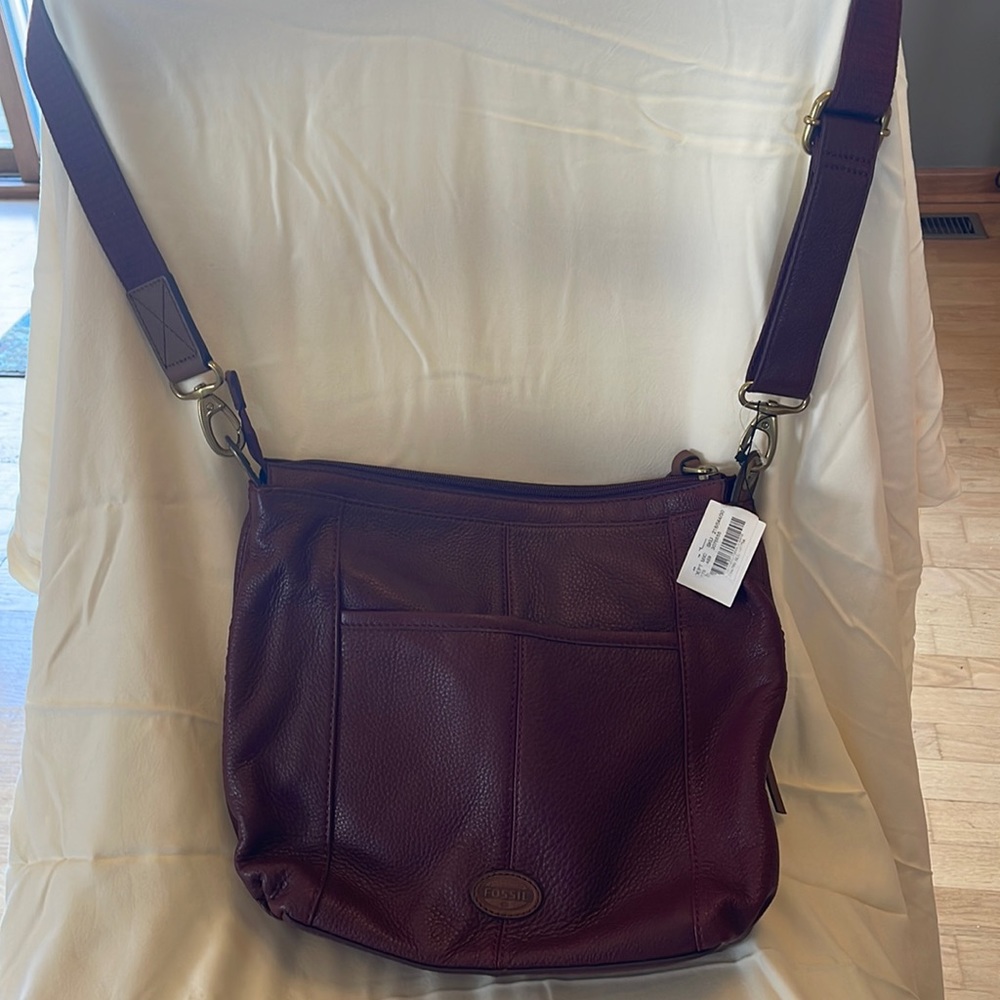 Large, leather Fossil burgundy purse. New, never used.